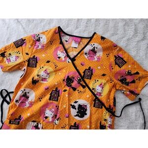 Hello Kitty Halloween Scrub Top XS Orange Mock Wrap Glow in the Dark Bats Witch
